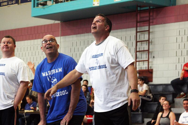Wareham Middle School teacher Dave Brogioli boxes out Lt. Col. Matthew Stanton of the high school during the faculty fundraiser held Wednesday. BY MATTHEW BERNAT